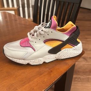 Cream, black, purple, and orange Nike Air Huarache
